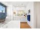 Bright bathroom featuring a soaking tub, walk-in shower, and a large vanity with ample storage at 455 Rogers Way, Castle Rock, CO 80104