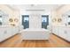 Luxurious bathroom featuring a soaking tub, separate vanities, and dual walk-in showers at 455 Rogers Way, Castle Rock, CO 80104