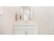 Bright, minimalist bathroom features a single sink and a large mirror at 455 Rogers Way, Castle Rock, CO 80104