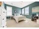 Comfortable bedroom features neutral carpet, a metal frame bed, white dresser, and bright windows with custom shutter shades at 455 Rogers Way, Castle Rock, CO 80104