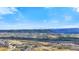 Scenic distant view with houses, rolling hills, and mountain peaks against a clear blue sky at 455 Rogers Way, Castle Rock, CO 80104