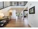 Spacious entrance foyer leading to dining area, featuring a modern staircase and wood floors at 455 Rogers Way, Castle Rock, CO 80104