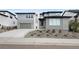 Modern two-story home featuring a stylish stone facade, attached garage, and well-maintained landscaping at 455 Rogers Way, Castle Rock, CO 80104