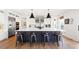 Modern kitchen with large island, stainless steel appliances, and stylish pendant lights at 455 Rogers Way, Castle Rock, CO 80104