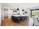Bright kitchen with large island, stainless steel appliances, and backyard access at 455 Rogers Way, Castle Rock, CO 80104