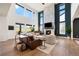 Elegant living room with high ceilings, fireplace, and views at 455 Rogers Way, Castle Rock, CO 80104