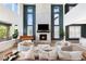 Cozy living room with a stone fireplace and natural light at 455 Rogers Way, Castle Rock, CO 80104