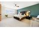 Spacious main bedroom with a ceiling fan, ample natural light, and stylish decor at 455 Rogers Way, Castle Rock, CO 80104