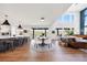 Bright open-concept living space with modern kitchen and dining area at 455 Rogers Way, Castle Rock, CO 80104