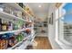 Walk-in pantry with abundant shelving for organized storage at 455 Rogers Way, Castle Rock, CO 80104