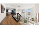 Bright staircase with modern railing leading to an open-concept living area with great natural light at 455 Rogers Way, Castle Rock, CO 80104