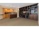 Entertaining basement features a wet bar and custom built in shelving and entertainment center at 7220 Spring Creek Cir, Niwot, CO 80503