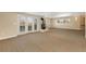 Finished basement with a fireplace, carpet, and French doors leading to the backyard at 7220 Spring Creek Cir, Niwot, CO 80503