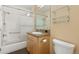 Standard bathroom with tile flooring, a shower-tub combo and a mirrored vanity at 7220 Spring Creek Cir, Niwot, CO 80503