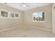 Bright bedroom with neutral carpet, ceiling fan, and shuttered windows that let in lots of natural light at 7220 Spring Creek Cir, Niwot, CO 80503