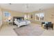 Bright bedroom with shuttered windows, neutral tones, and a decorative area rug at 7220 Spring Creek Cir, Niwot, CO 80503