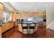 Well-lit kitchen featuring black countertops and stainless steel appliances contrasting with light wood cabinetry at 7220 Spring Creek Cir, Niwot, CO 80503