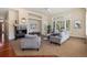 Bright living room with fireplace, plantation shutters, and neutral decor offers a cozy gathering space at 7220 Spring Creek Cir, Niwot, CO 80503