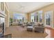 Inviting living room with large windows, plantation shutters, and modern decor at 7220 Spring Creek Cir, Niwot, CO 80503
