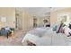 Bright main bedroom with soft carpet, chair with blanket, and balcony access at 7220 Spring Creek Cir, Niwot, CO 80503