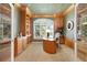 Beautiful home office featuring custom built-ins, a unique desk, and a bright window at 7220 Spring Creek Cir, Niwot, CO 80503