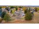 Home exterior showcasing large backyard, mature trees, and deck at 7220 Spring Creek Cir, Niwot, CO 80503