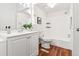 Bathroom with modern fixtures, tile floors, and a combined shower and tub at 2297 S Oswego Way, Aurora, CO 80014