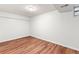 Bedroom with laminate floors and a small window at 2297 S Oswego Way, Aurora, CO 80014