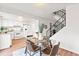 Dining area adjacent to the kitchen with modern decor and plenty of natural light from nearby windows at 2297 S Oswego Way, Aurora, CO 80014