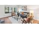 Bright living room with large window, comfortable seating, and stylish decor for a relaxing atmosphere at 2297 S Oswego Way, Aurora, CO 80014