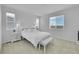 Bright bedroom featuring fresh white walls, plush carpet, and sun-drenched windows for a serene retreat at 4612 S Wenatchee St # A, Aurora, CO 80015