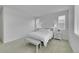 Bright bedroom featuring fresh white walls, plush carpet, and sun-drenched windows for a serene retreat at 4612 S Wenatchee St # A, Aurora, CO 80015
