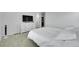 Serene bedroom with ensuite bath, large TV and closet, featuring carpet floors and bright neutral paint at 4612 S Wenatchee St # A, Aurora, CO 80015