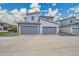 Modern home exterior with grey siding, two-car garage, and well-manicured landscaping for curb appeal at 4612 S Wenatchee St # A, Aurora, CO 80015