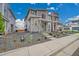 Charming home exterior with stone accents, covered porch, and landscaped yard enhancing its welcoming facade at 4612 S Wenatchee St # A, Aurora, CO 80015