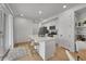 A modern kitchen with a large island and stainless steel appliances at 4612 S Wenatchee St # A, Aurora, CO 80015