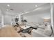 Open-concept living room and kitchen area with hardwood floors and recessed lighting at 4612 S Wenatchee St # A, Aurora, CO 80015