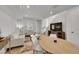A bright, open living space with modern furnishings, flowing into the dining area at 4612 S Wenatchee St # A, Aurora, CO 80015