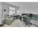 Office featuring an adjustable chair, multi-monitor workstation and relaxation chair at 4612 S Wenatchee St # A, Aurora, CO 80015