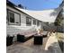 Spacious outdoor patio featuring comfortable seating, shade sail, and a well-maintained fence at 4463 Steele St, Denver, CO 80216