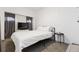 Bright bedroom with a comfortable bed, large window with curtains, and a modern side table at 4463 Steele St, Denver, CO 80216