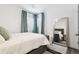 Bright and airy bedroom with large windows, plush bedding, and a stylish full-length mirror with wood flooring at 4463 Steele St, Denver, CO 80216