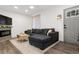 Inviting living room features a stylish sofa, modern fireplace, and a cozy atmosphere with wood flooring at 4463 Steele St, Denver, CO 80216