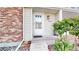 Charming front entrance offering curb appeal with its brick accents and inviting doorway at 8300 W 87Th Dr # B, Arvada, CO 80005