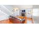 Cozy living room boasts hardwood floors, a brick fireplace, and ample natural light, creating a warm atmosphere at 8300 W 87Th Dr # B, Arvada, CO 80005