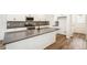 Spacious kitchen featuring a large island and white cabinetry at 1563 Orchard St, Brighton, CO 80601