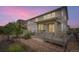 Back of the house features a porch and backyard dining set at 1063 Sandstone Cir, Erie, CO 80516