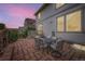 Backyard patio with seating and view of the two-story house at 1063 Sandstone Cir, Erie, CO 80516