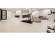 Open basement featuring a rec area, gym equipment, and light wood flooring at 1063 Sandstone Cir, Erie, CO 80516