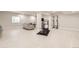 Spacious finished basement with a rec area, gym equipment, and light wood flooring at 1063 Sandstone Cir, Erie, CO 80516